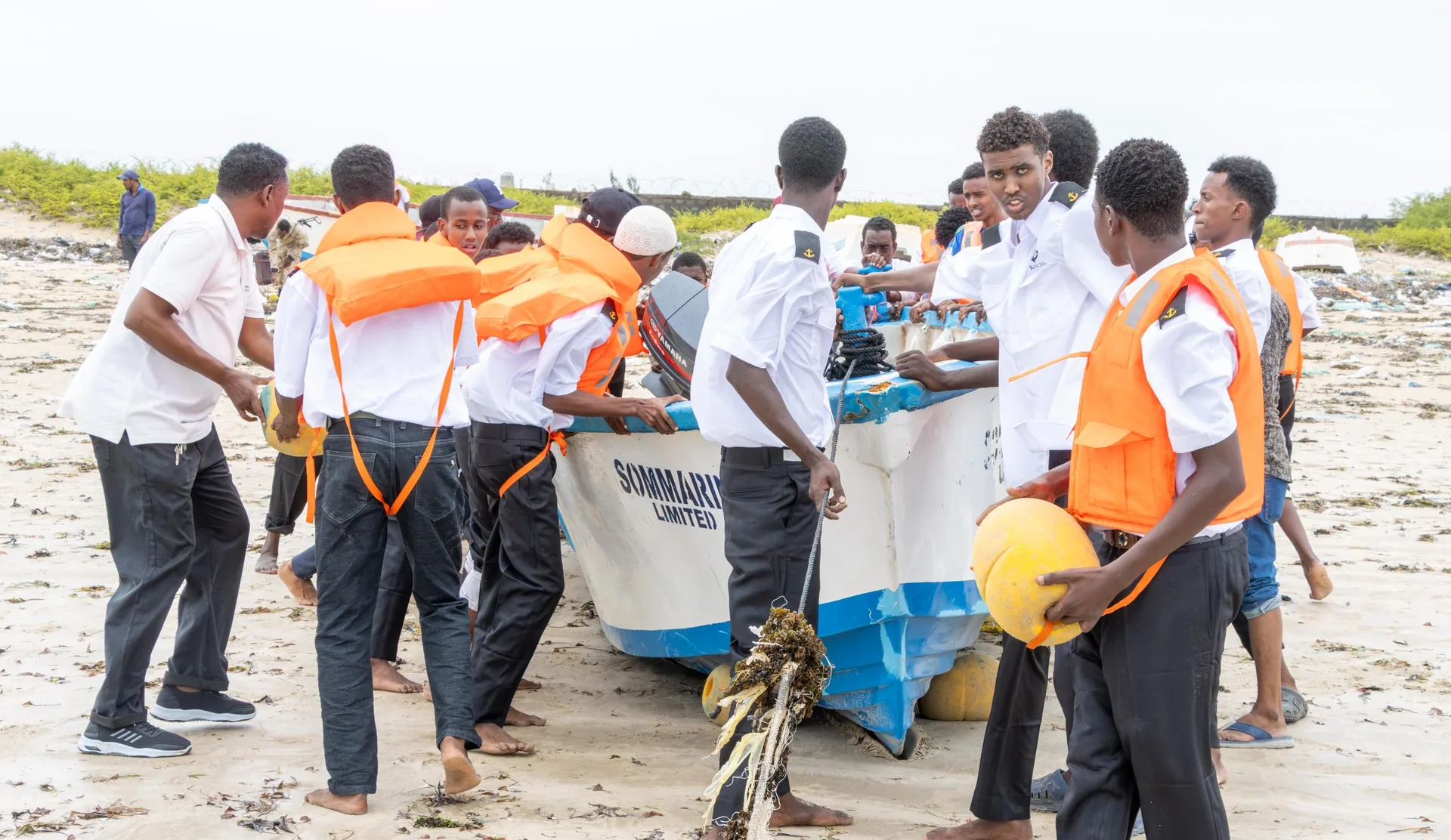 Official and community delegation attending a Sommarine boat launch