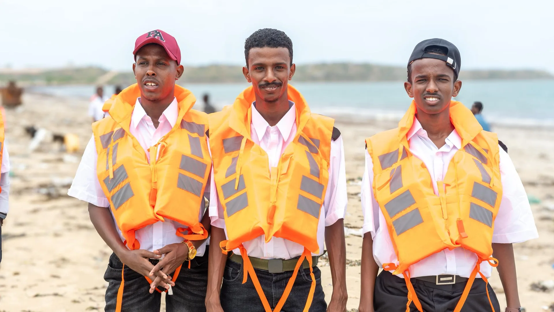 Coastal crew portrait beside the water