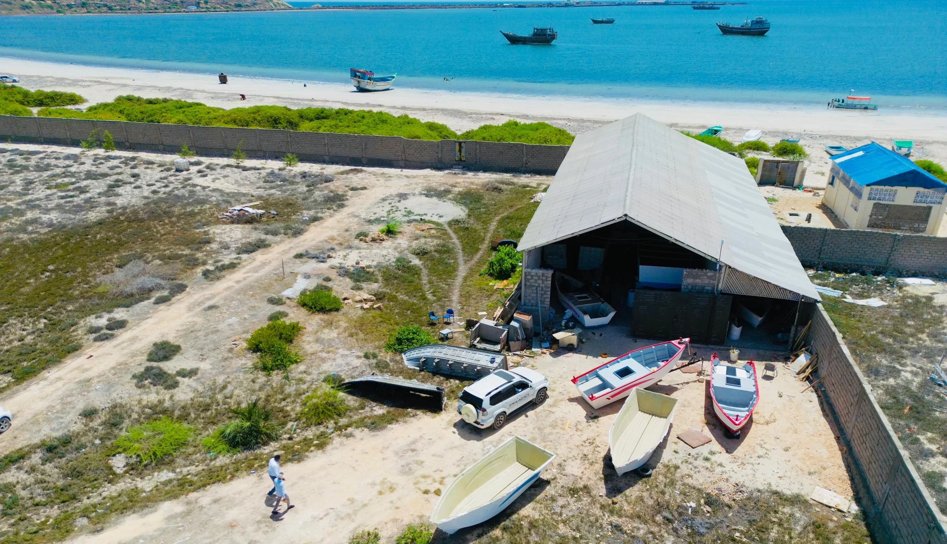 Aerial view of Sommarine's boat-building workshop and coastal yard