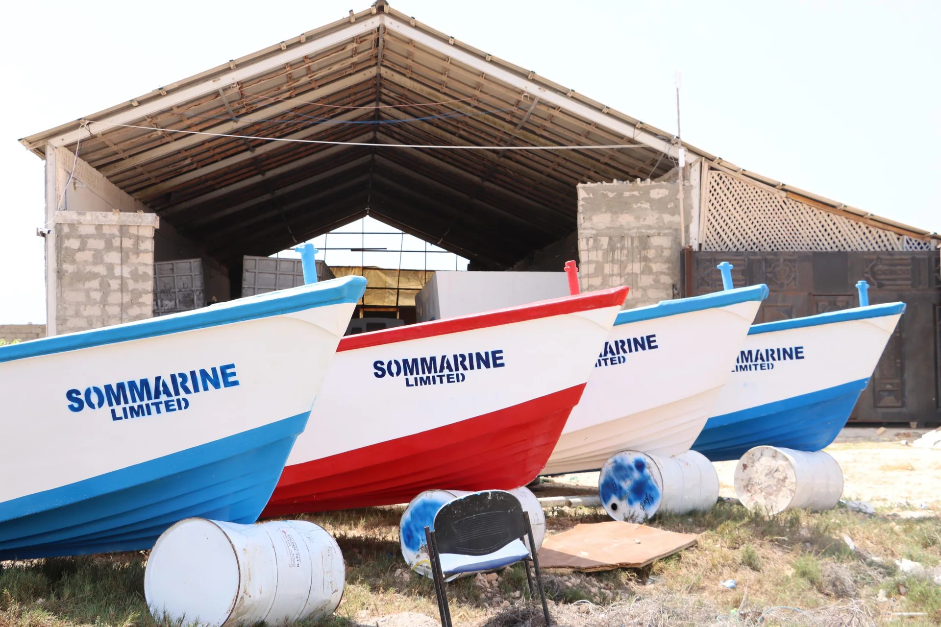 Sommarine fishing vessels lined up outside the Kismayo workshop